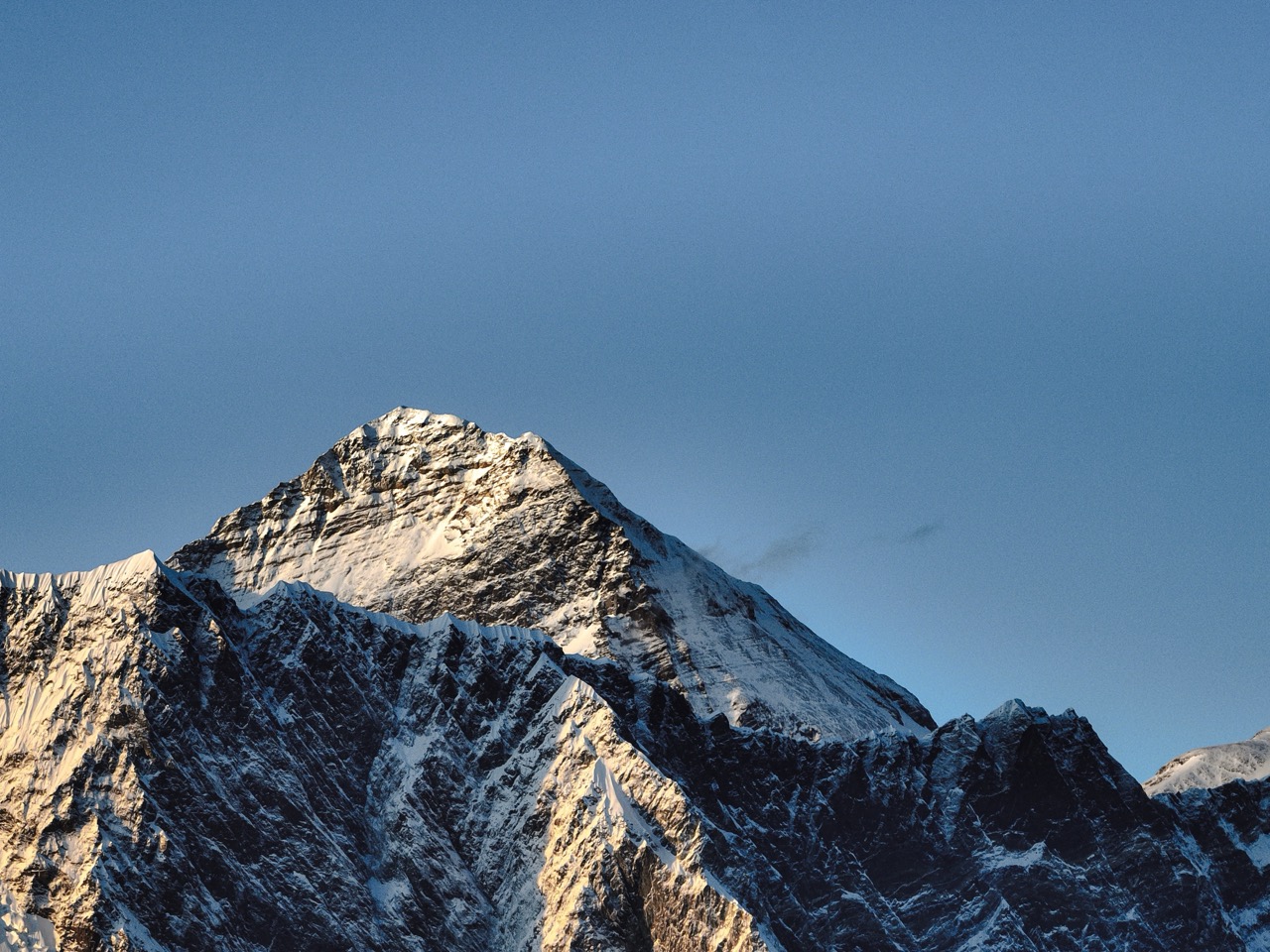 First light on a high Himalayan summit ridge