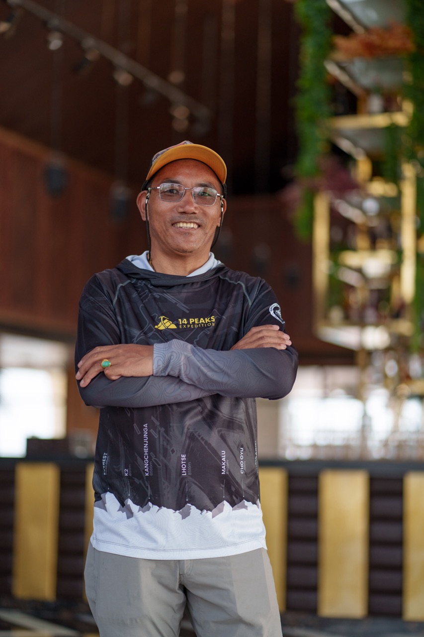 Portrait of a mountain professional, arms folded